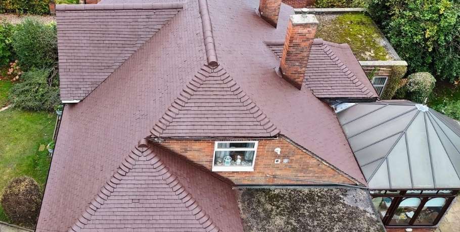Freshly coated and restored roof after professional roof spraying and painting service in Central Scotland