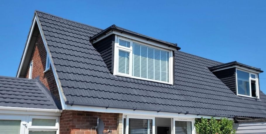 Fully restored and freshly coated tiled roof after expert roof spraying and painting service in Central Scotland